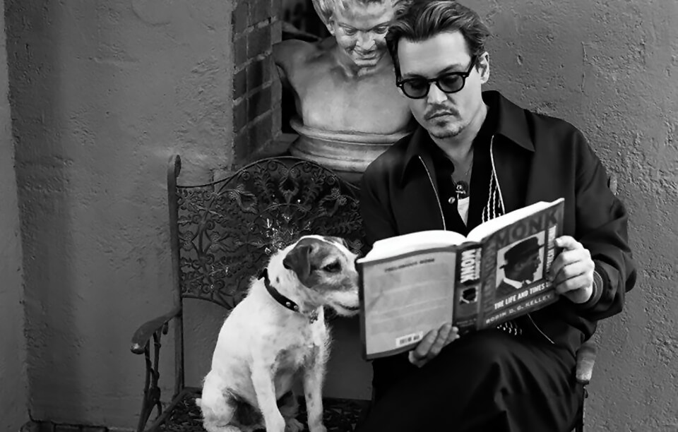 Uggie and Johnny Depp read a book